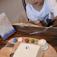 child painting cake