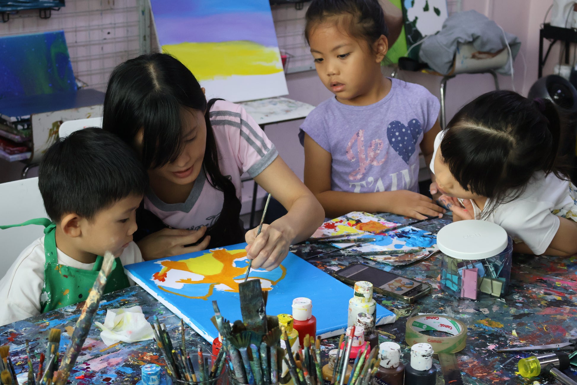 children learning to paint