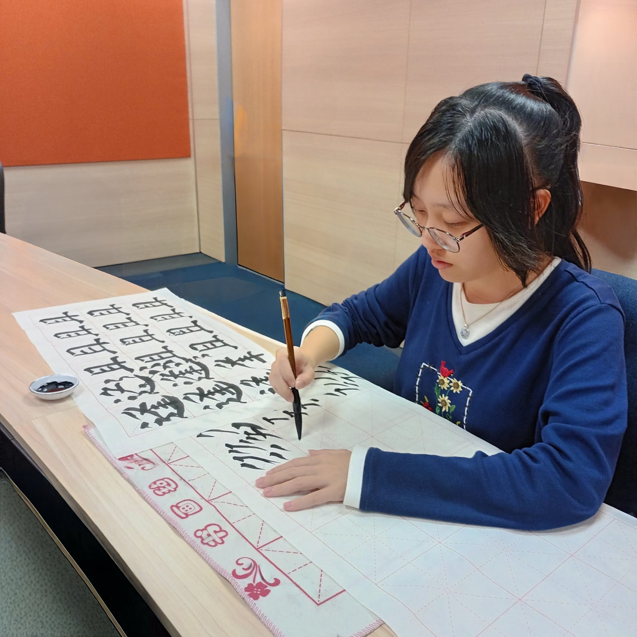 kids painting calligraphy