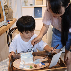 mum and child painting cake